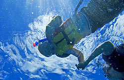 Young boy learning to snorkel at Molokini